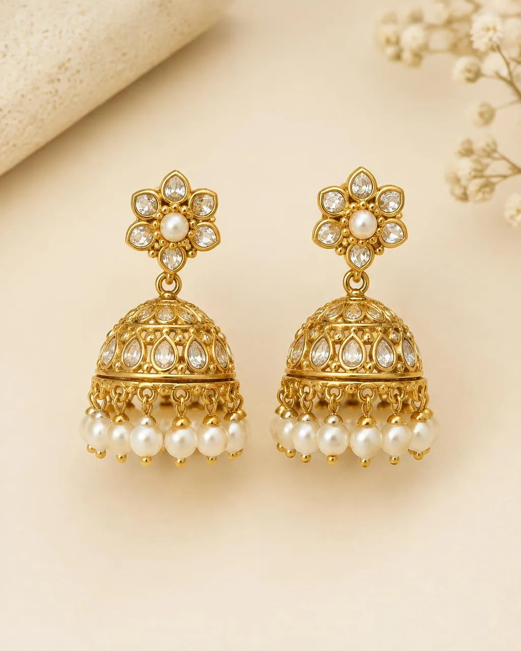 Gold-tone jhumka earrings with pearl drops